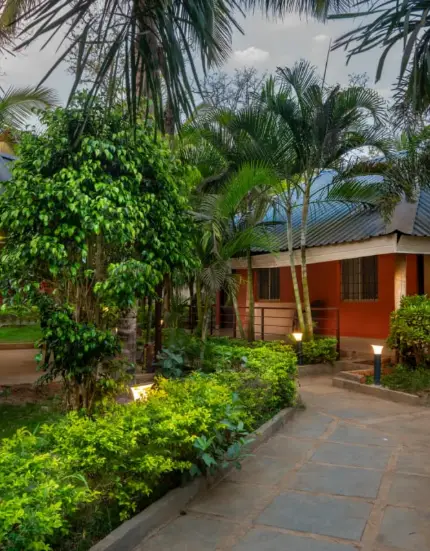 Spacious and modern interior of a Dandeli resort with comfortable seating and stylish decor for a relaxing stay.